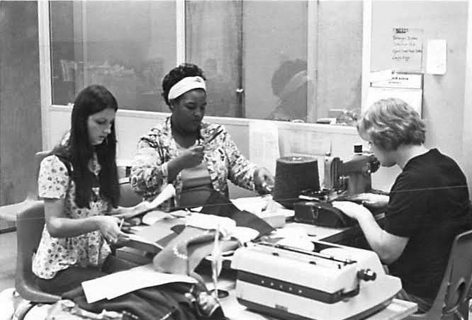 Historical photo os staff working at a library